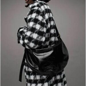 Allsaints half moon shoulder bag in black shine